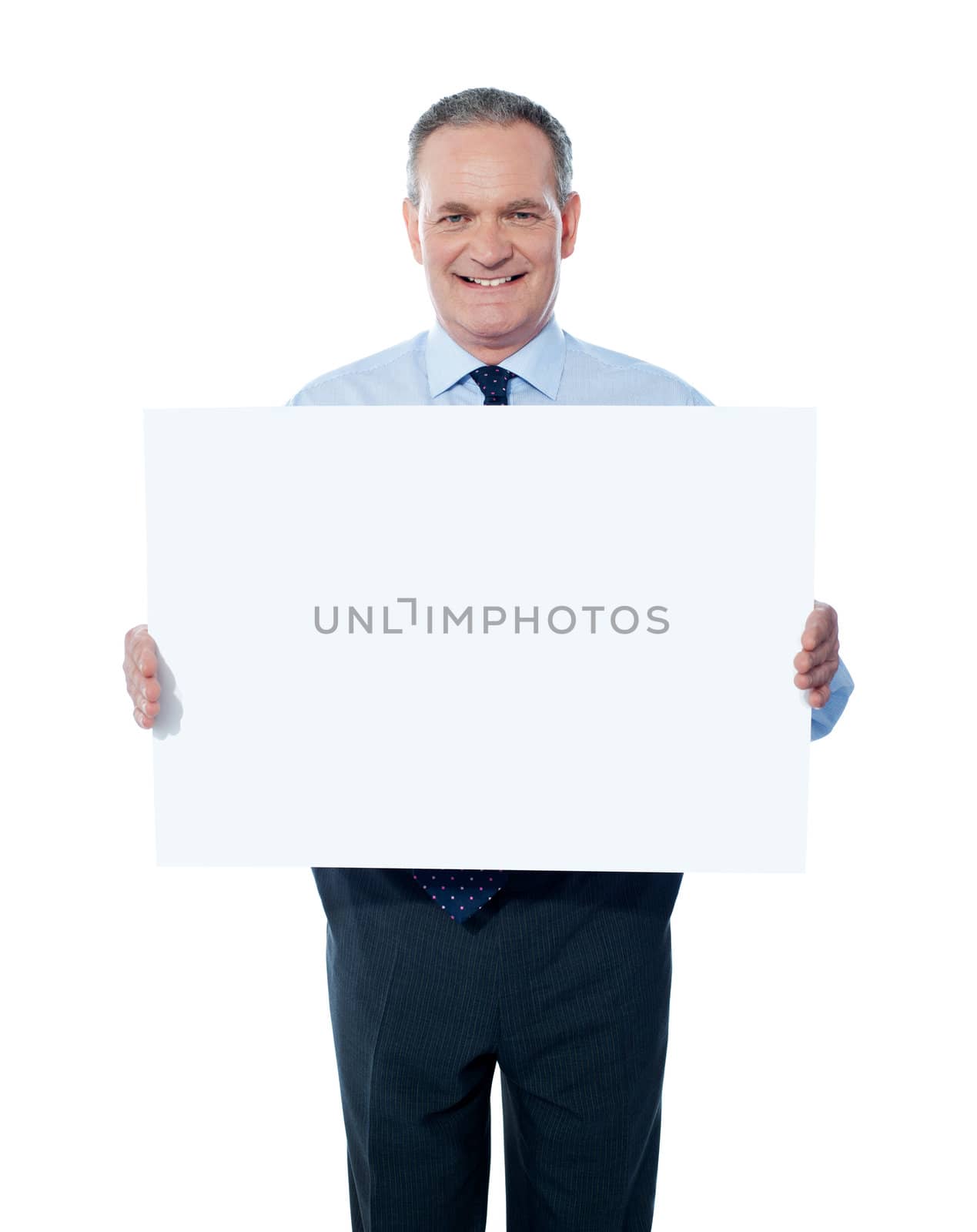 Handsome man holding blank white billboard. Showing to camera