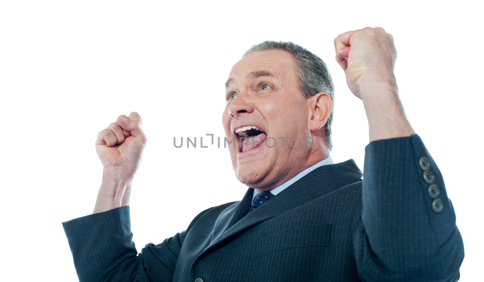 Elder businessman in a victory pose. Isolated over white