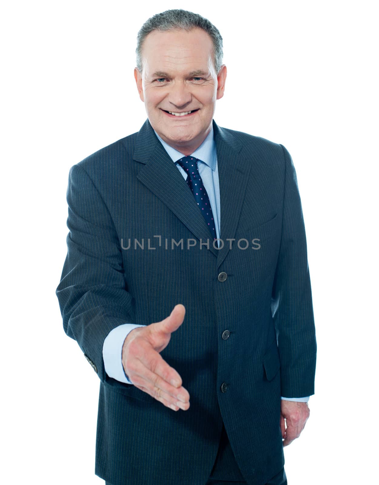 Businessman offering handshake to you, studio shot