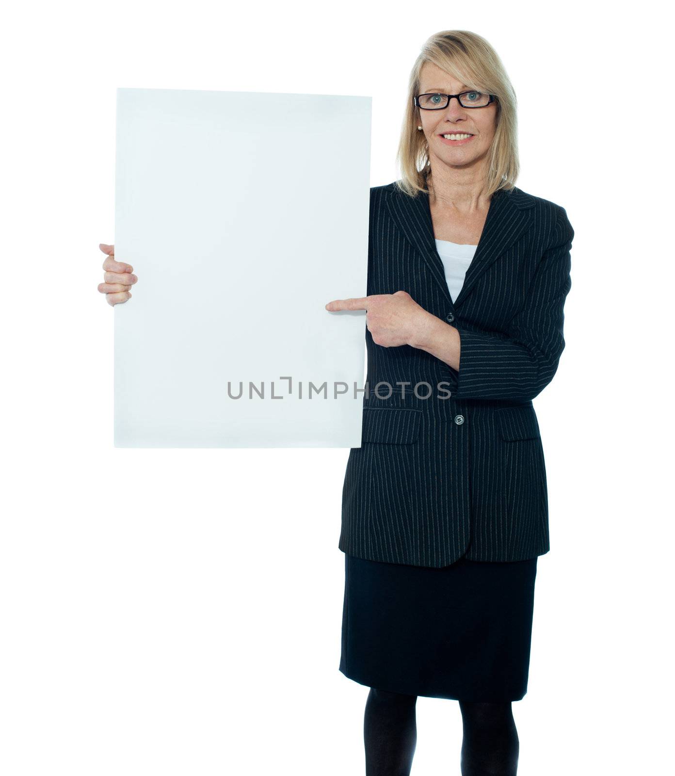 Business woman displaying placard to camera by stockyimages