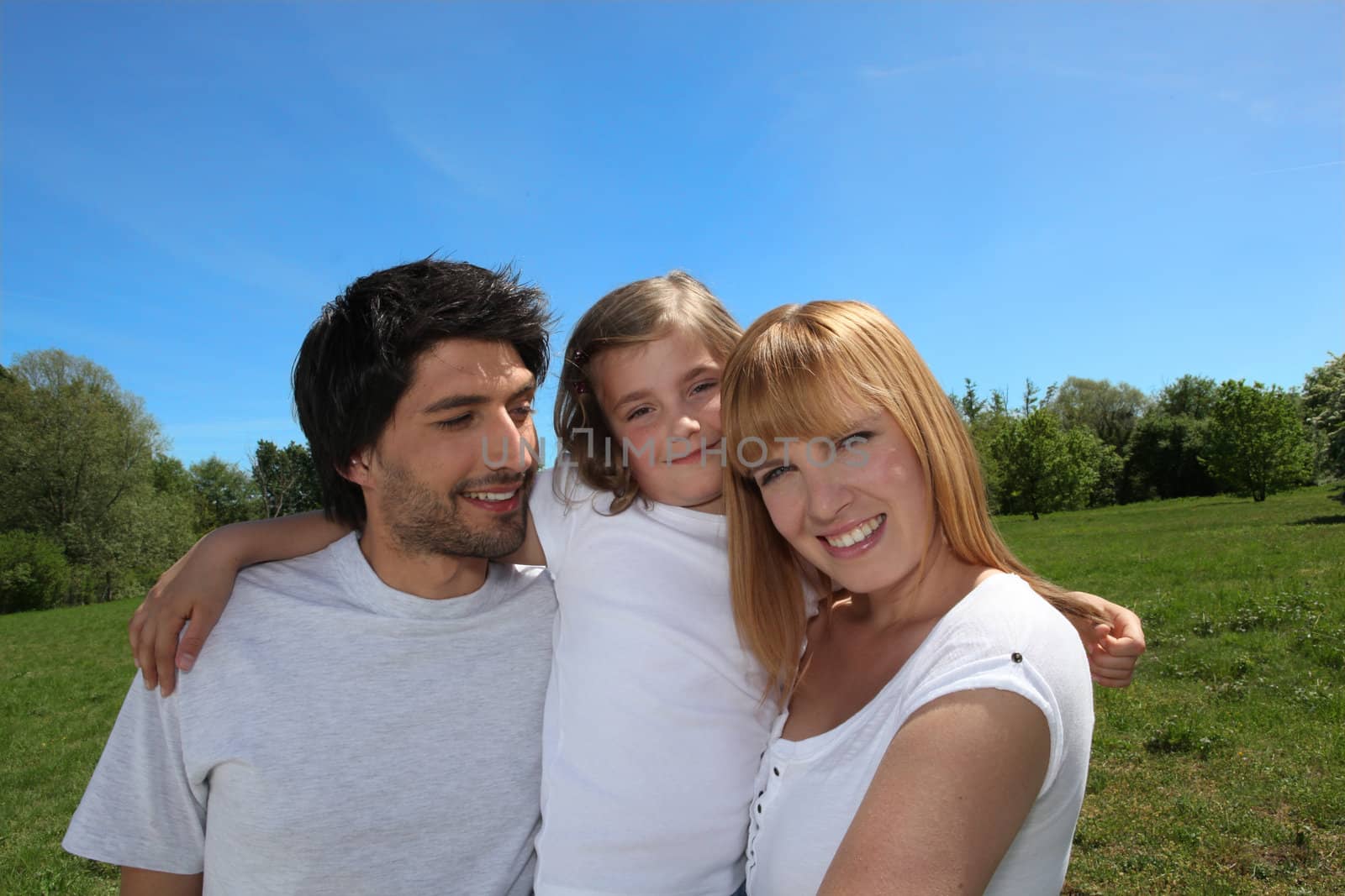 Happy family enjoying a day out in the sunshine together