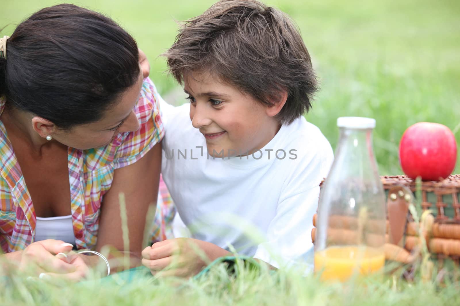 Mother and son having a summer picnic