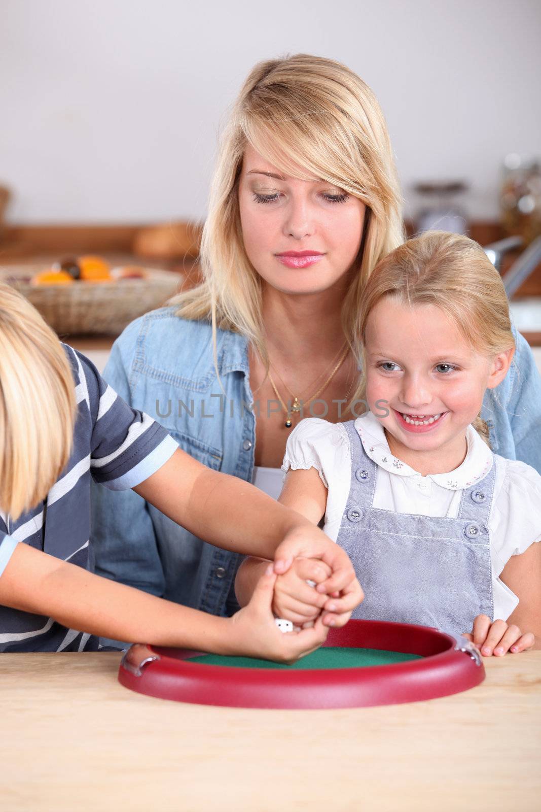 Family playing game with dice