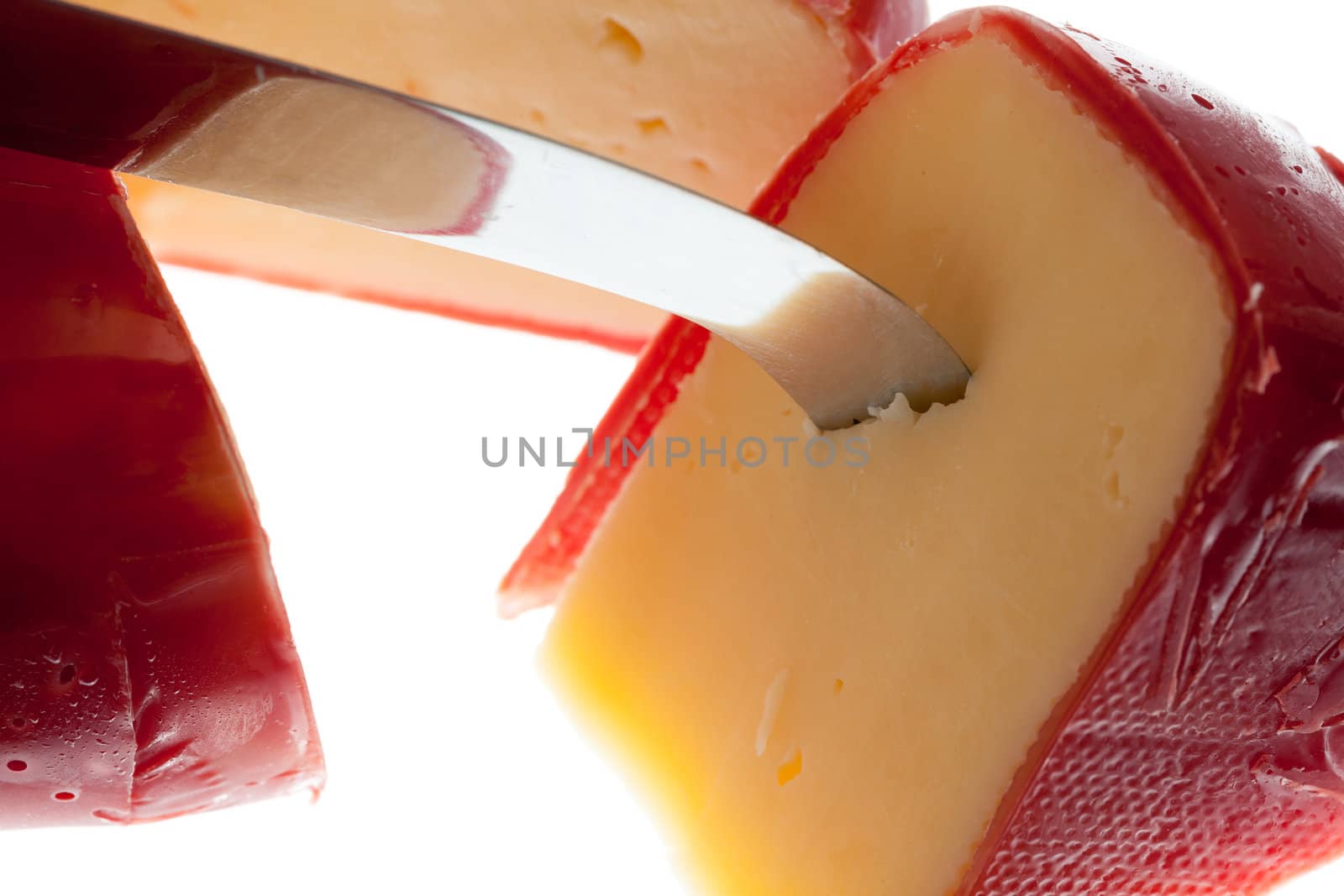 Circular round dutch covered in red wax protection with knife