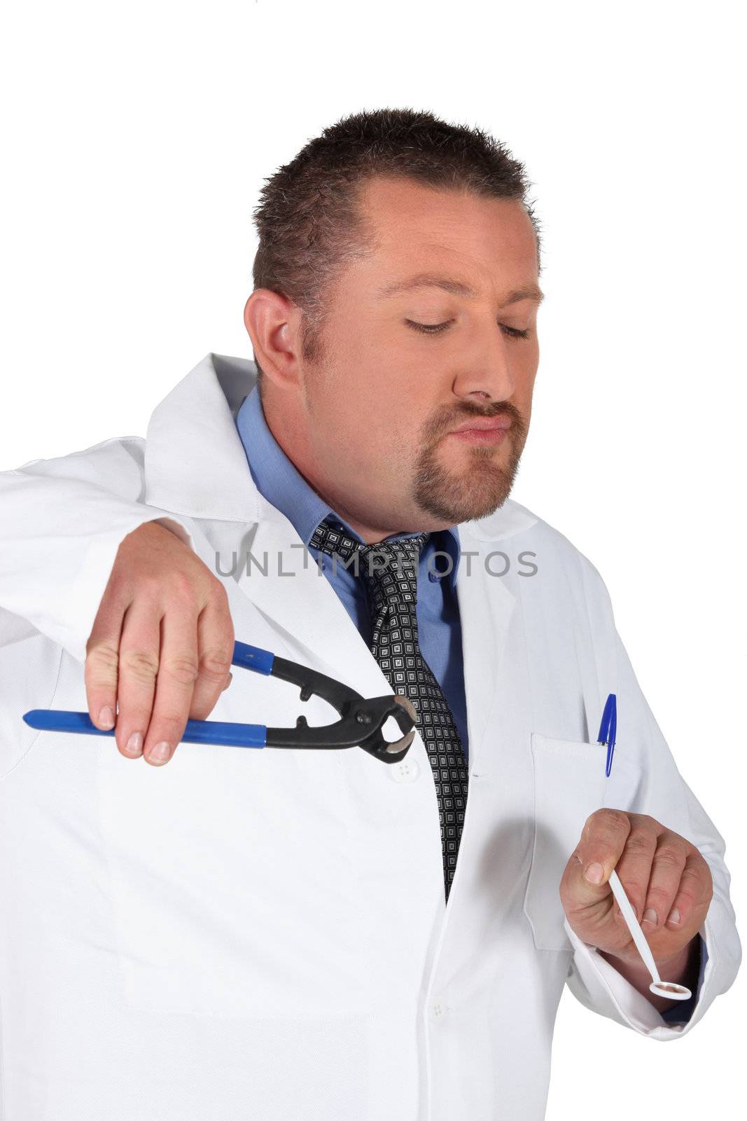 Dentist holding mirror and pliers by phovoir