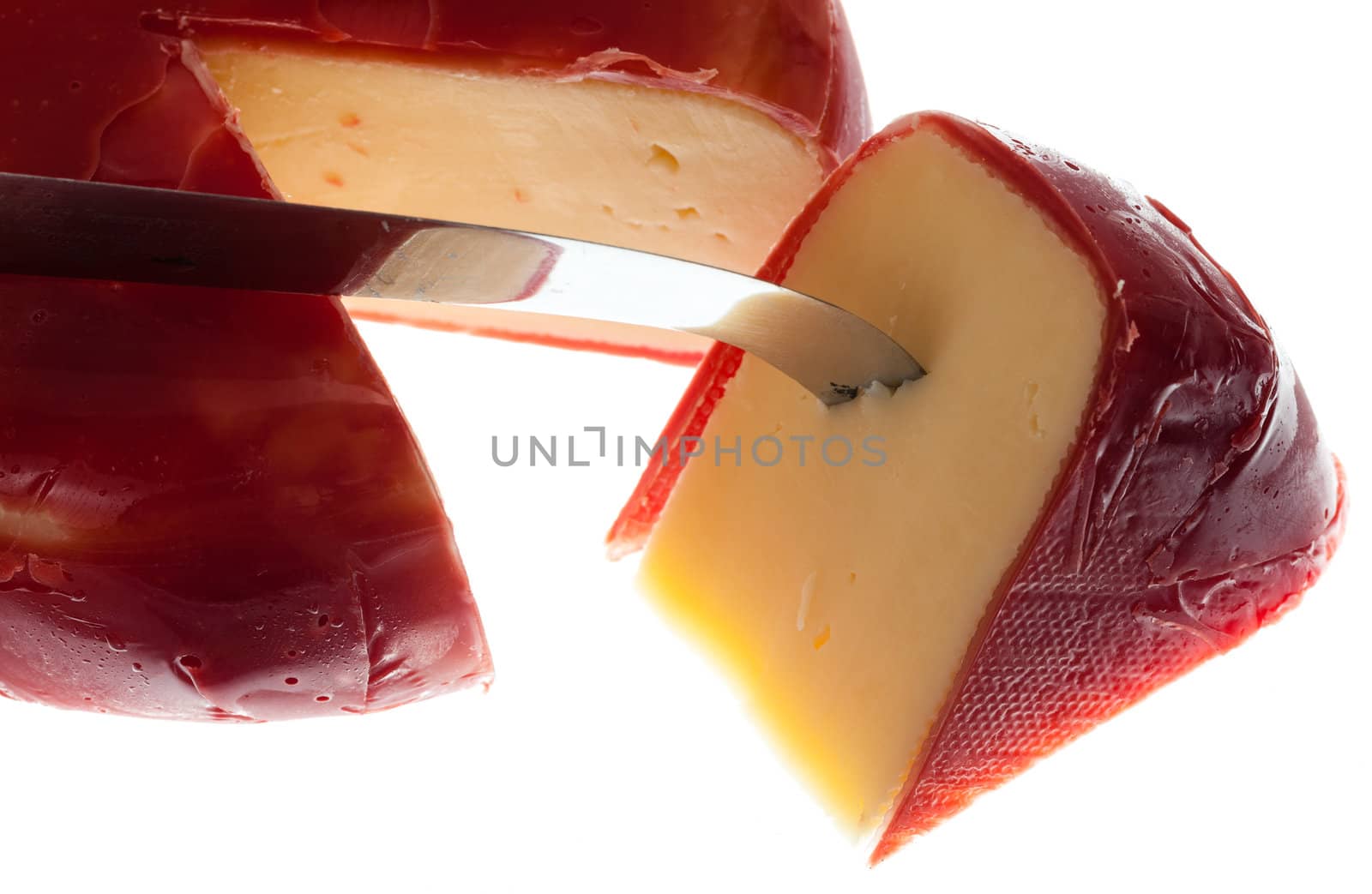 Circular round dutch covered in red wax protection with knife