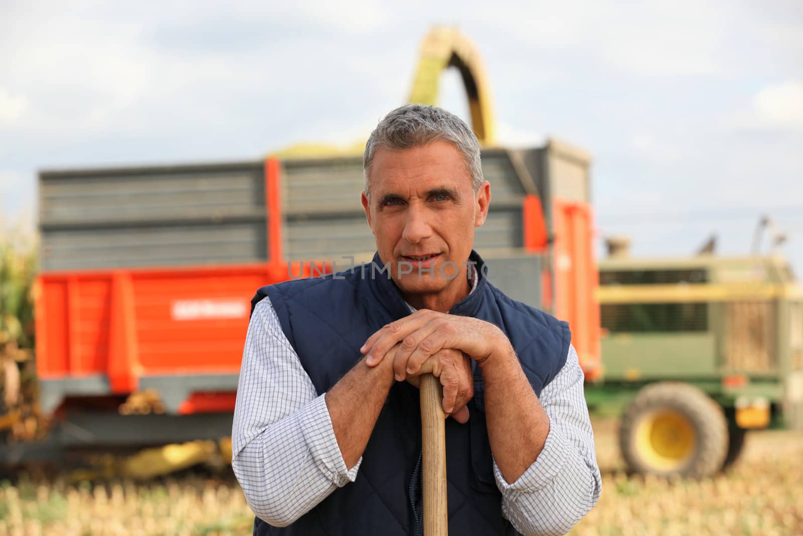 Farmer standing in front of a cattle transport vehicle