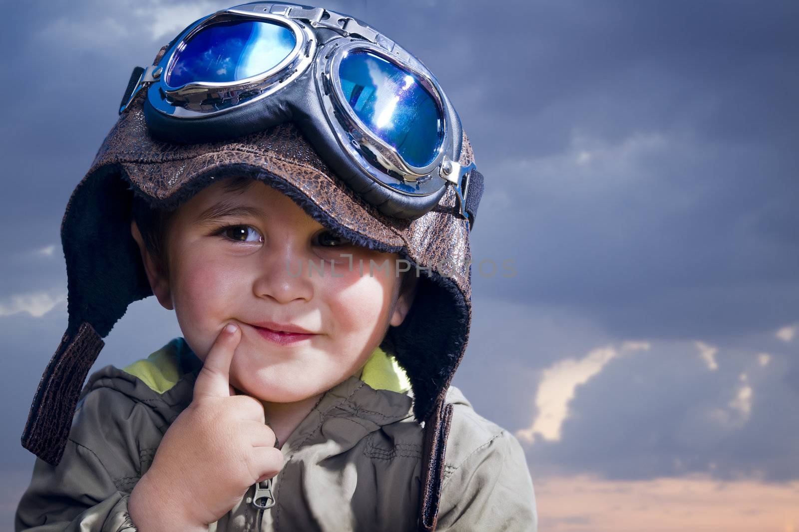 Adorable baby dressed in pilot uniform with funny face by FernandoCortes