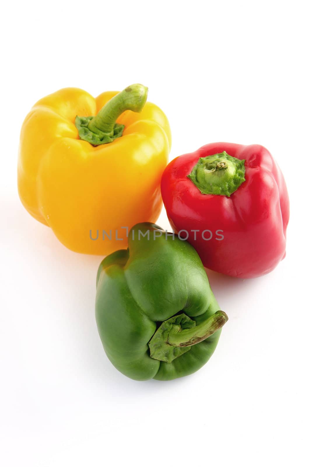 Red, green and yellow peppers