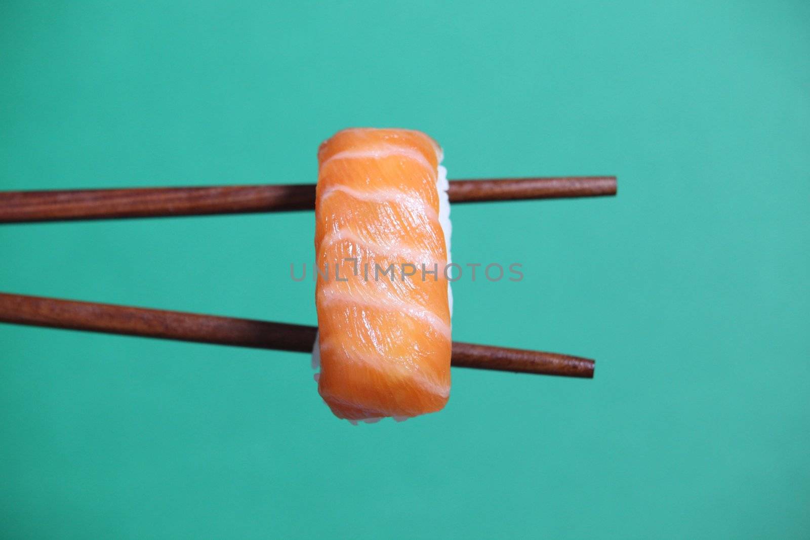 Sushi on chopsticks by phovoir