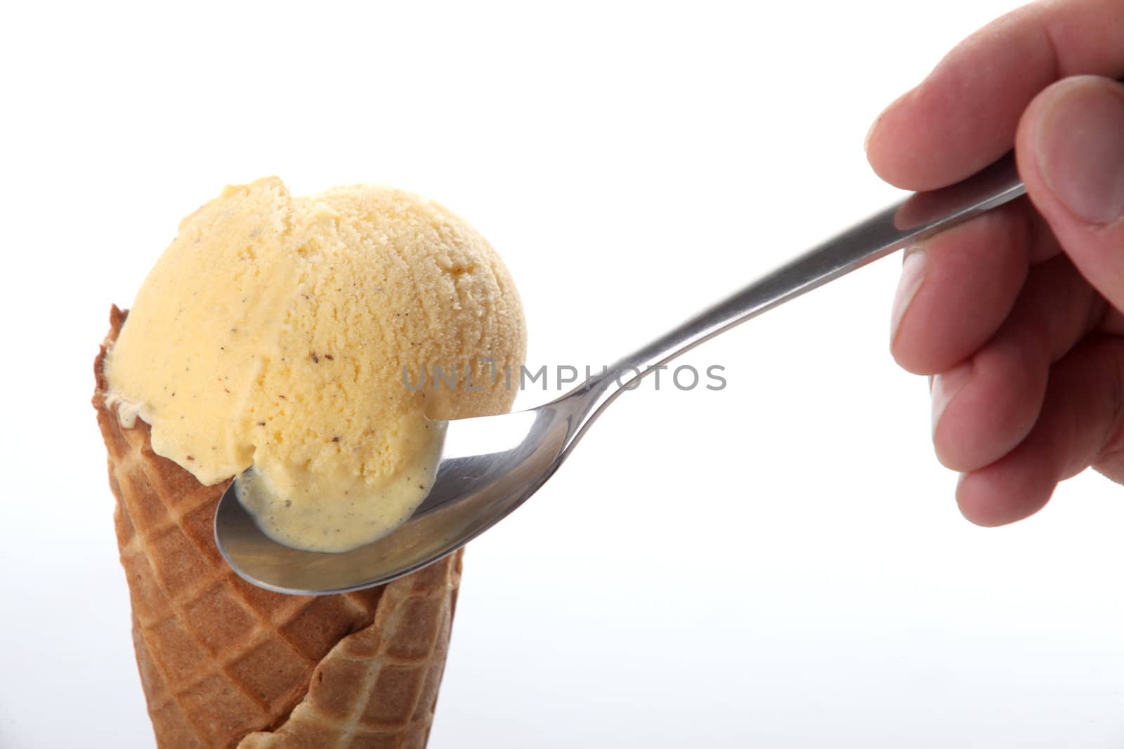 Studio closeup of vanilla ice cream cone