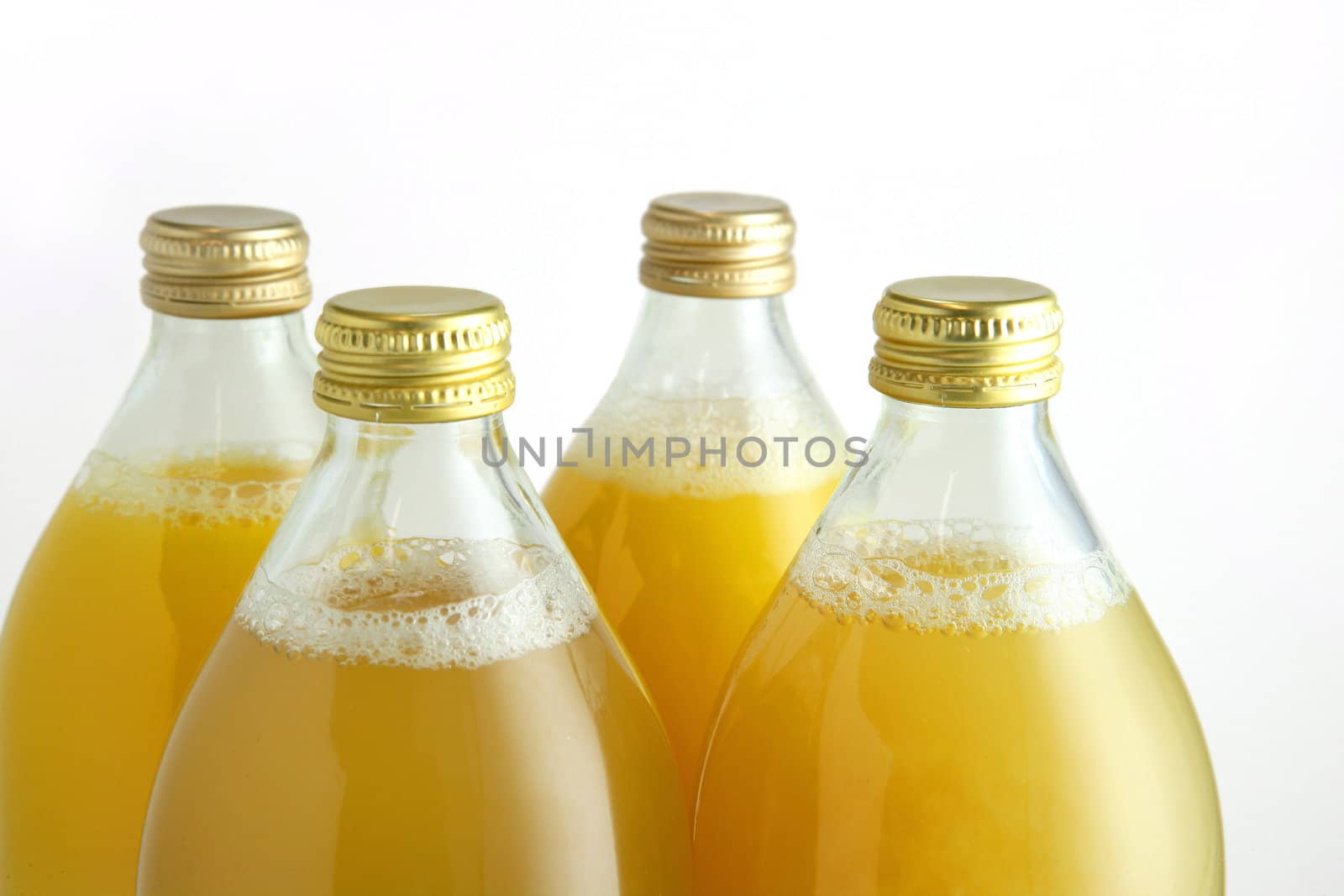 Bottles of fruit juice by phovoir