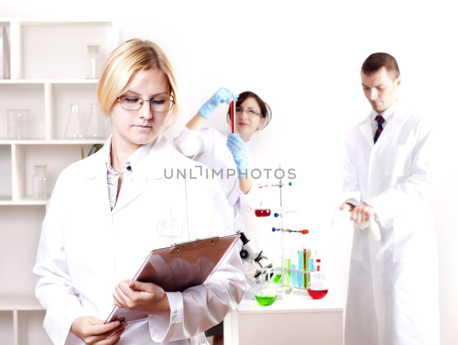 portrait of doctor, holds a tablet in the office