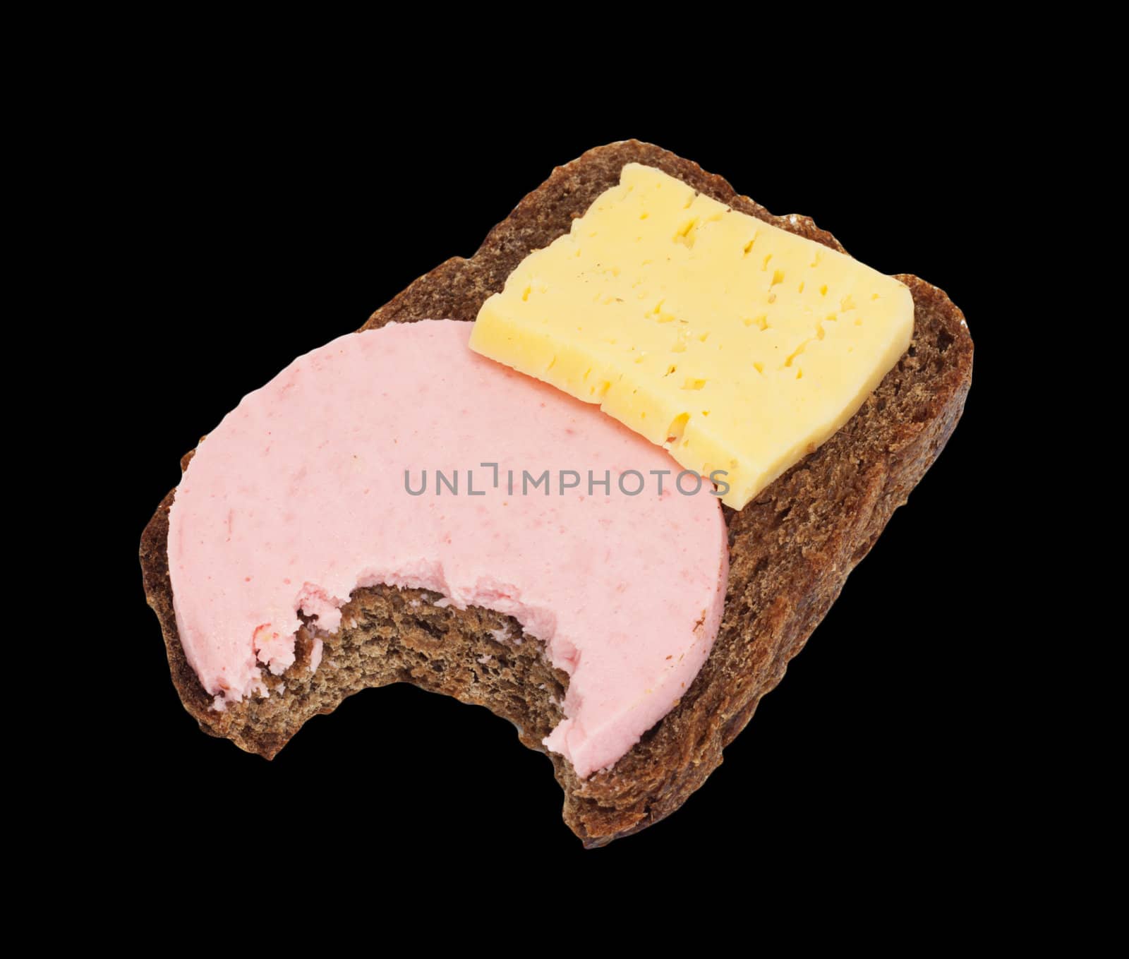 Bitten black bread with cheese and sausage