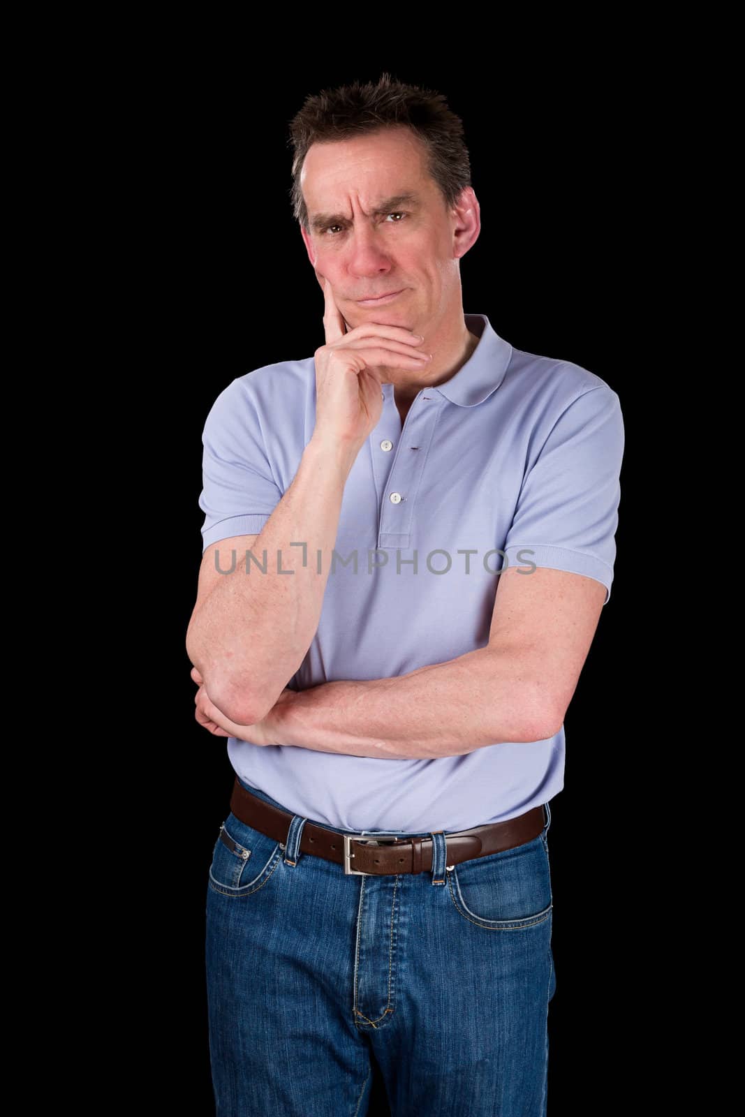 Confused Frowning Middle Age Man Hand to Chin Black Background
