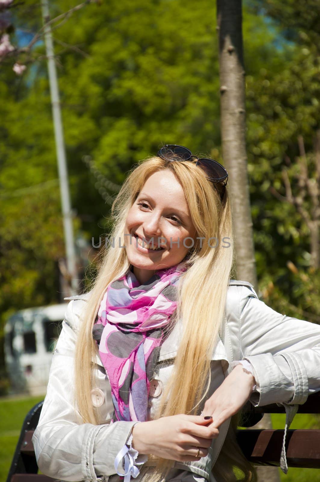 Beautiful young woman in the sunny park