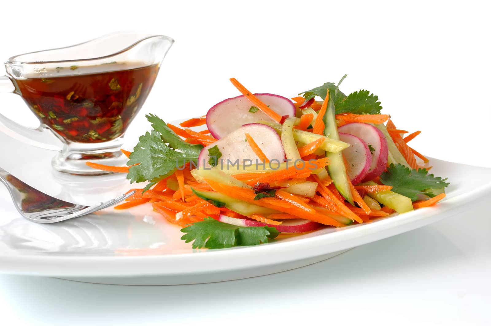 Salad of fresh carrots with the radish and cucumber