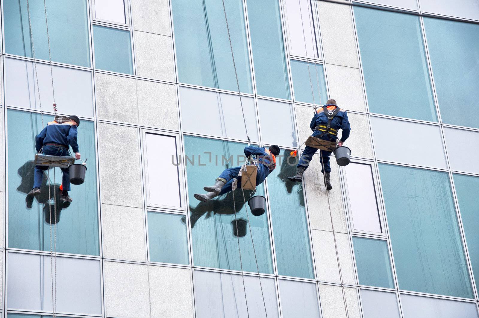 Window cleaner working on a glass facade