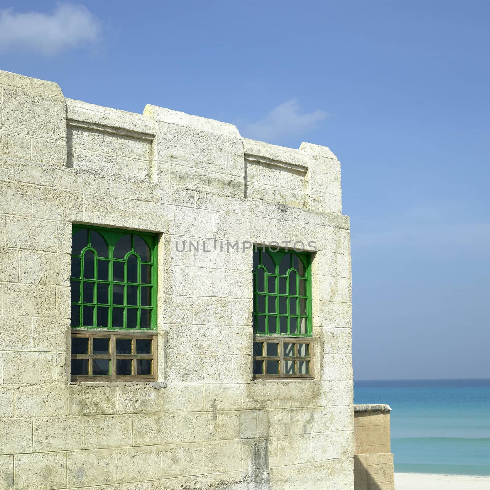 Old tropical villa made of stone blocks
