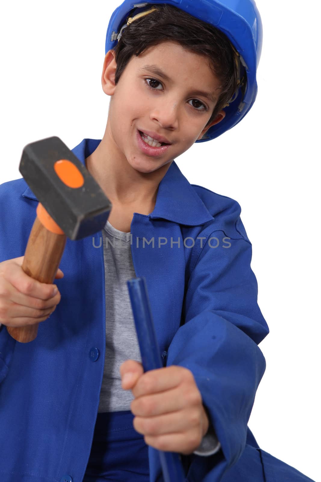 A kid dressed as a construction worker with a hammer. by phovoir