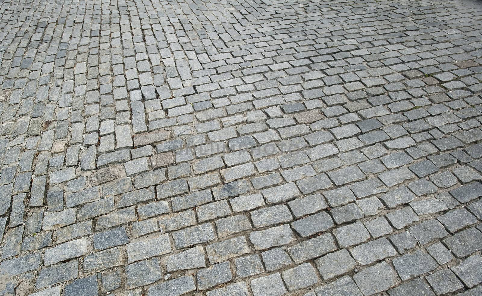 Closeup view on a cobblestone road - pattern - background