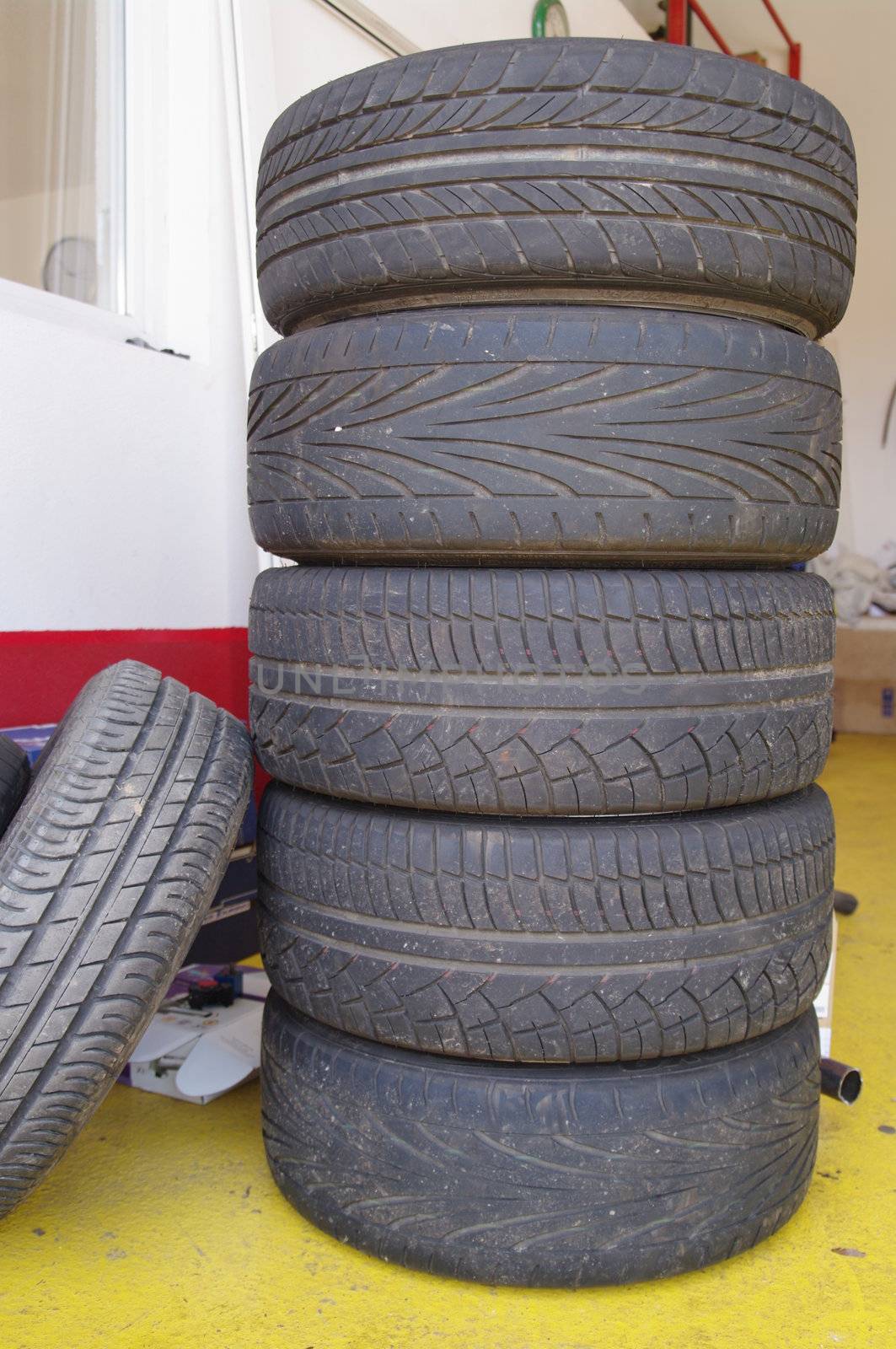 stack of used car wheels