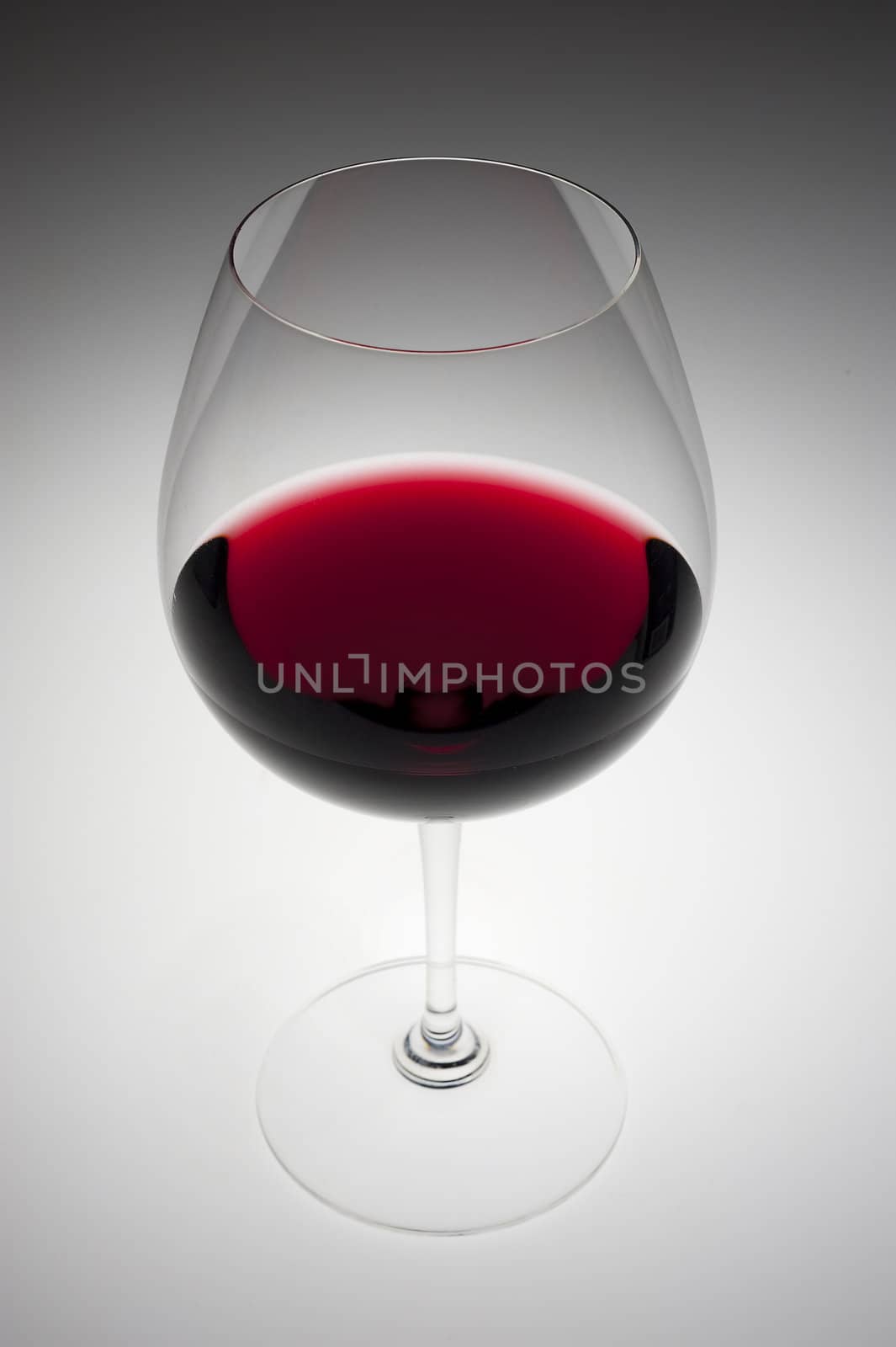 Red wine glass on gray by f/2sumicron