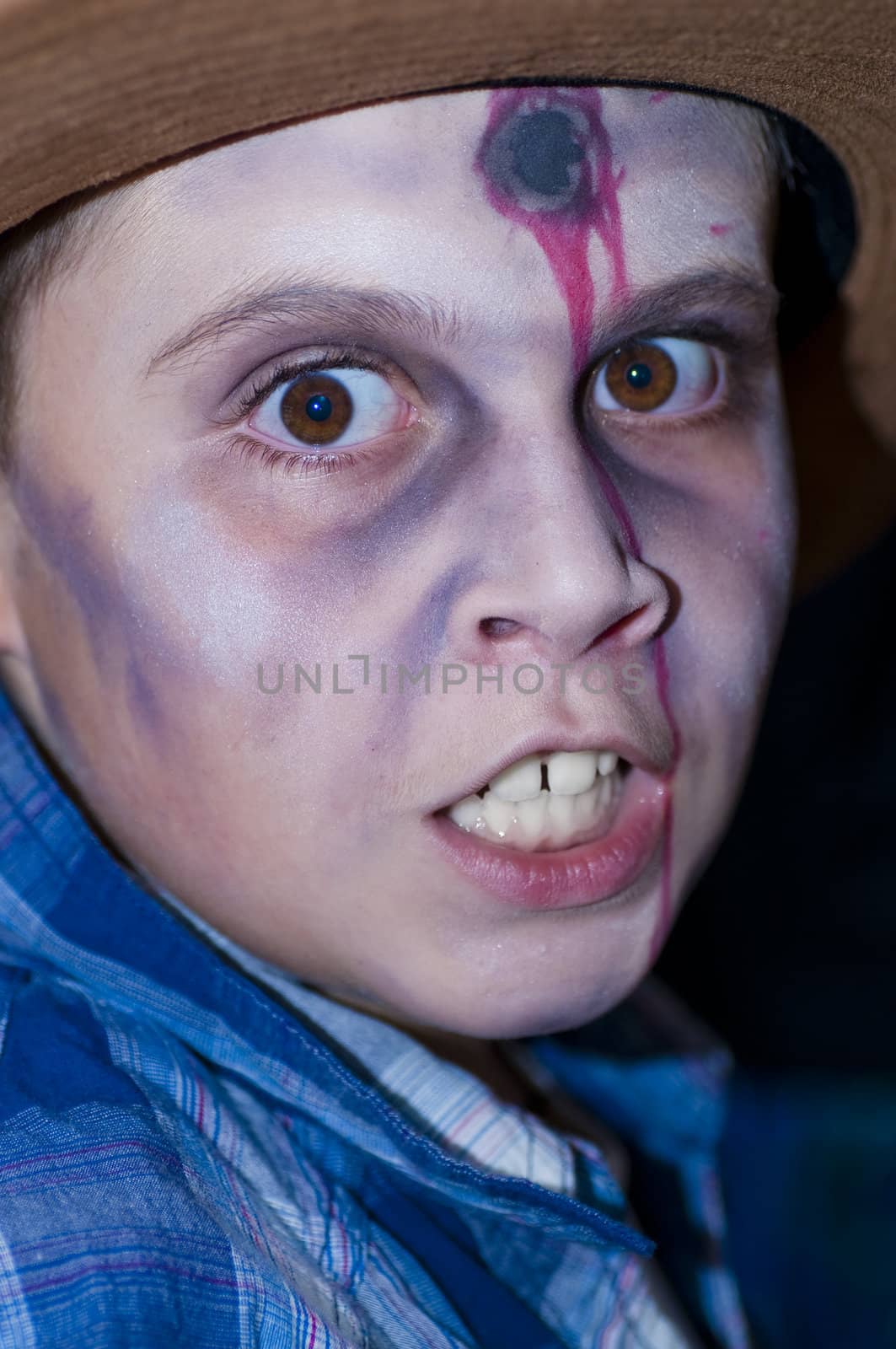 Boy dressed as zombie head shot