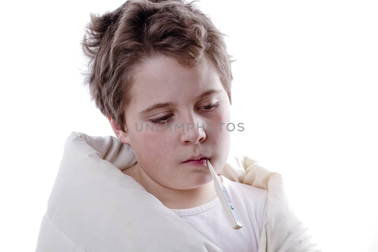 Young boy patient with fever, with digital thermometer and white blanketand flu