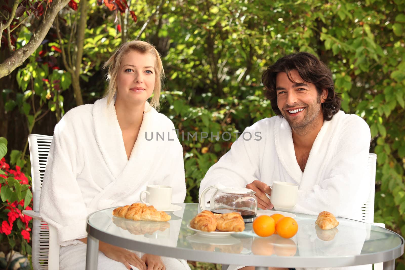 couple having breakfast outdoors