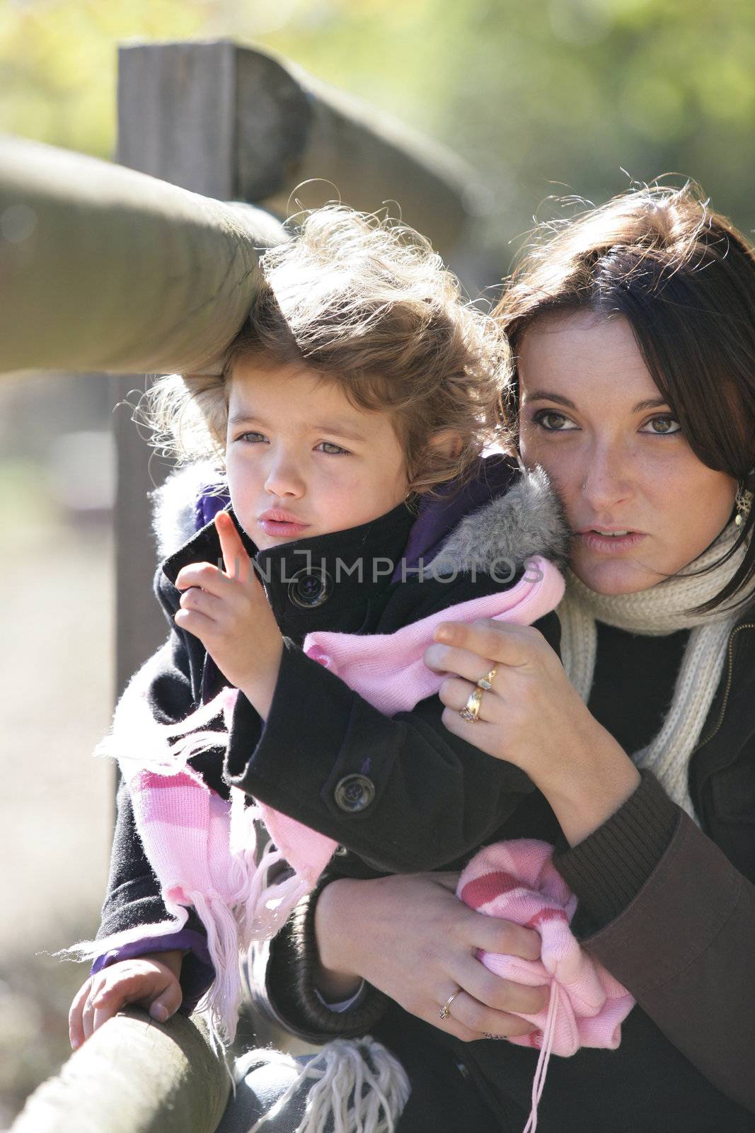 Woman and daughter outdoors by phovoir
