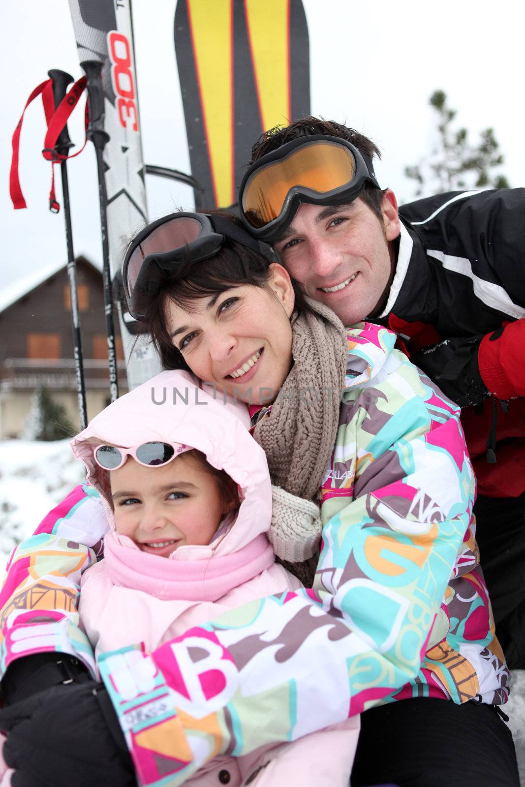 Young family on skiing holiday