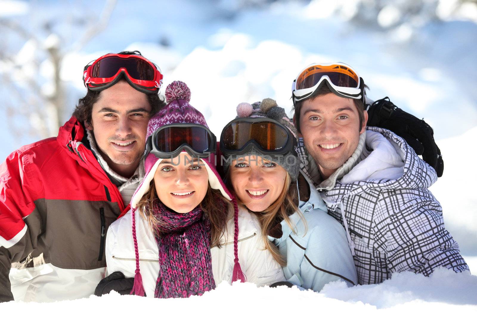 Two couples in a ski slope by phovoir