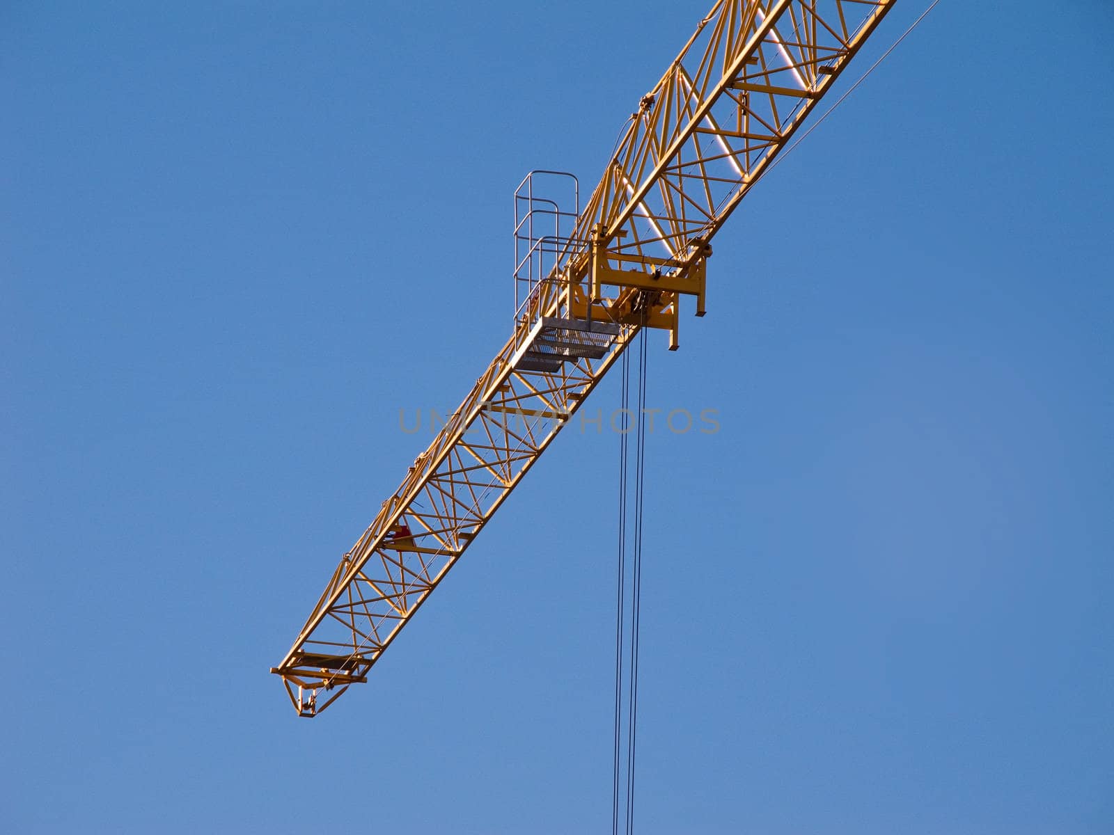 Detail of the jib of a yellow hoisting tower crane