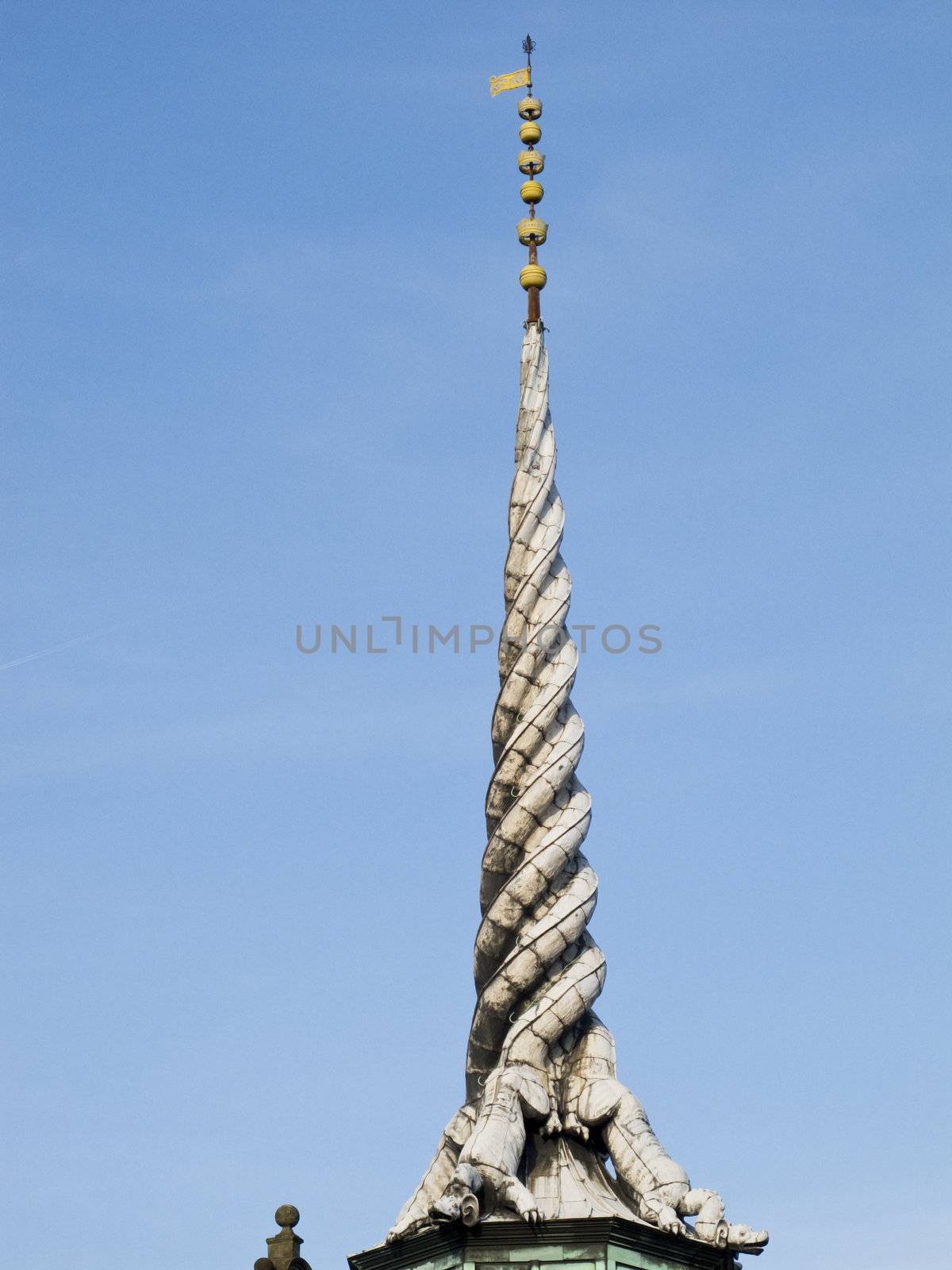 tower of the old stock exchange building in copenhagen, made of three dragon tails