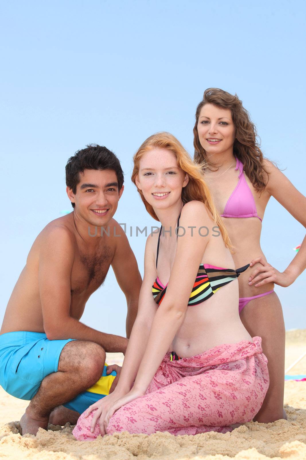 Three teenagers on the beach