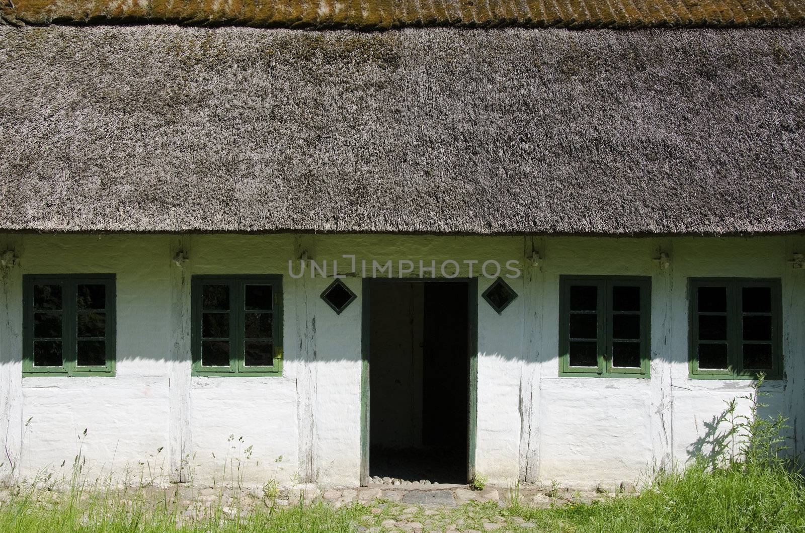 Medieval farm house in Denmark with thatched roof