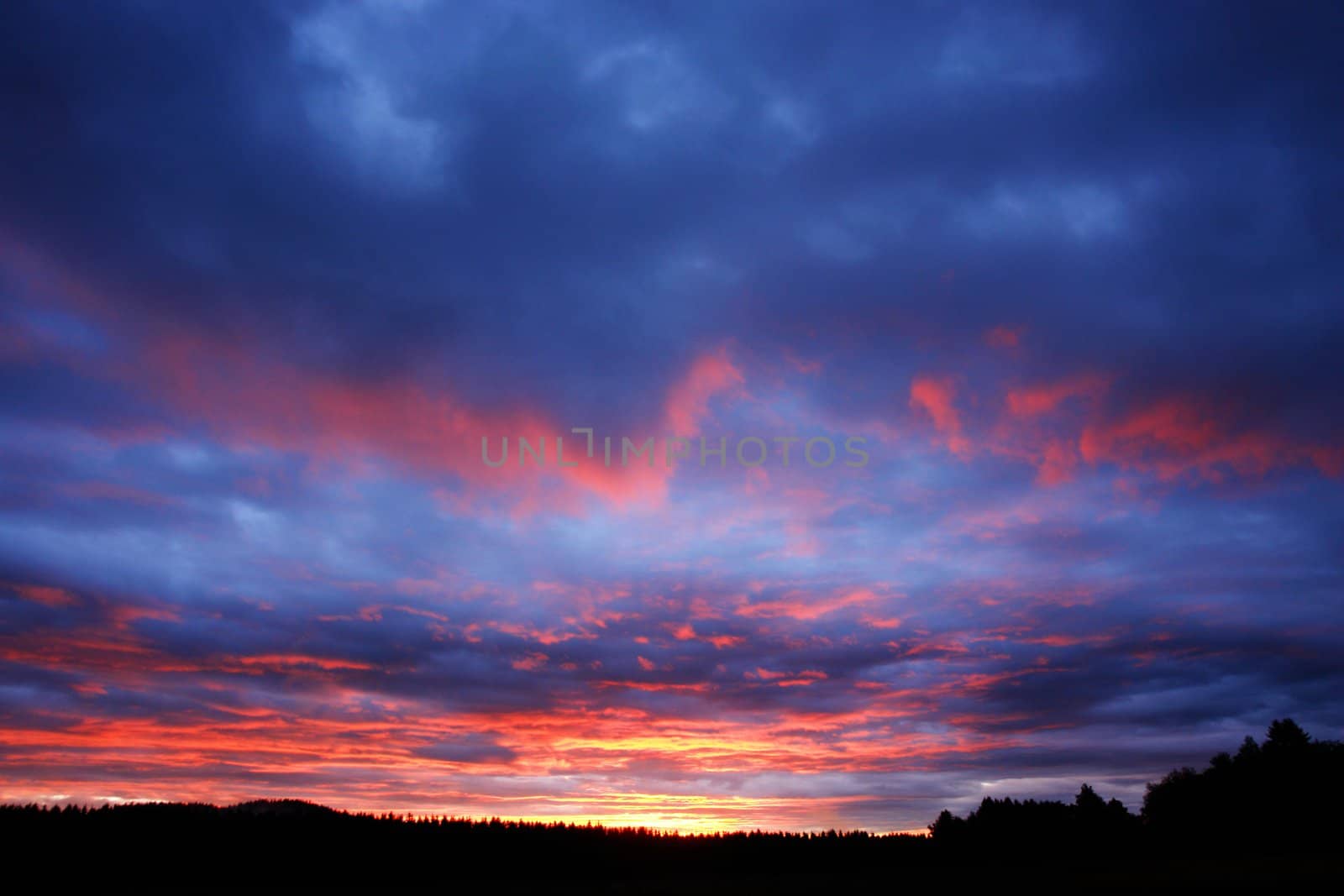 Storm Clouds At Sunset by yucas