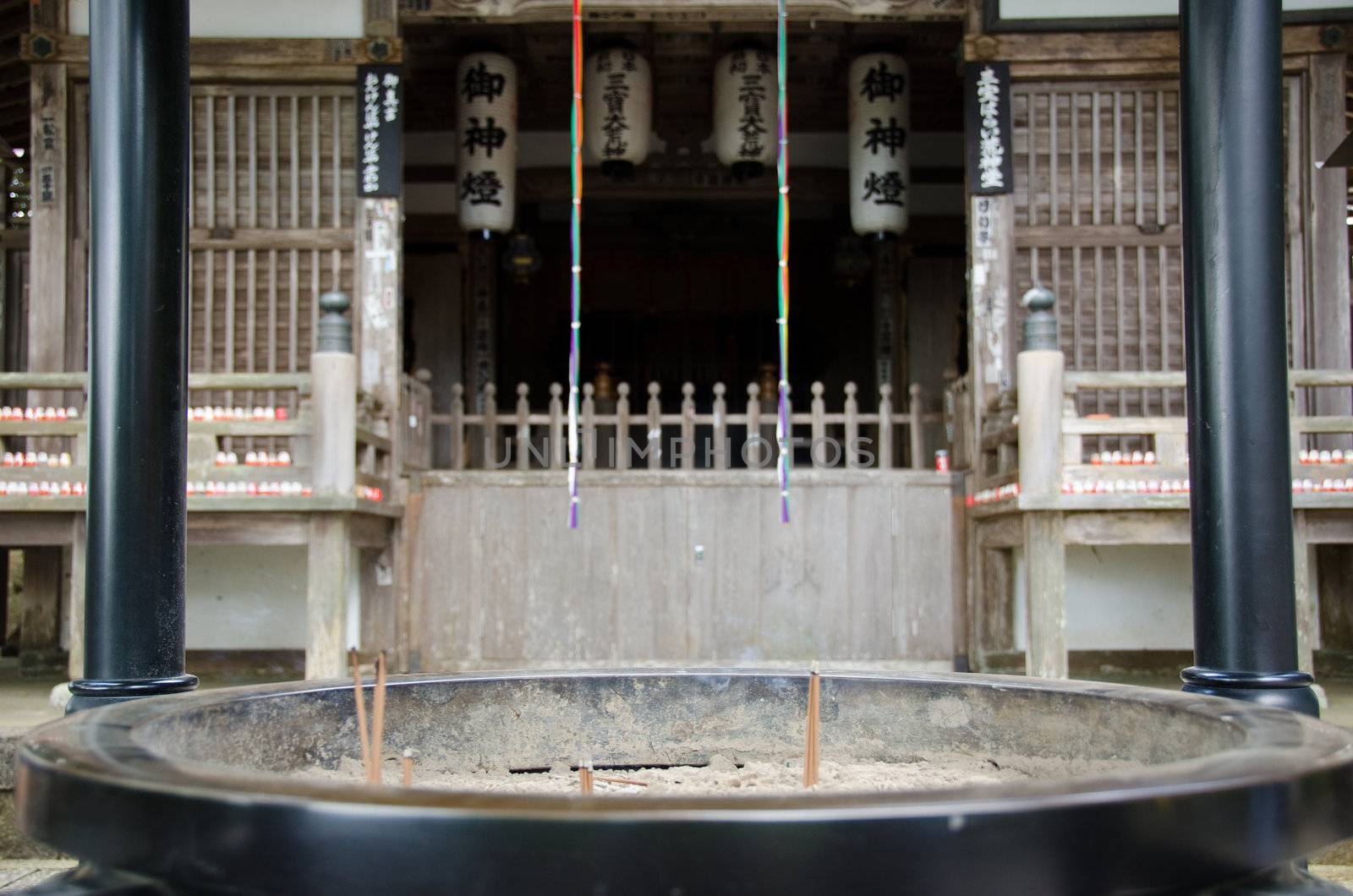 Japanese incense in front of a buddhist temple