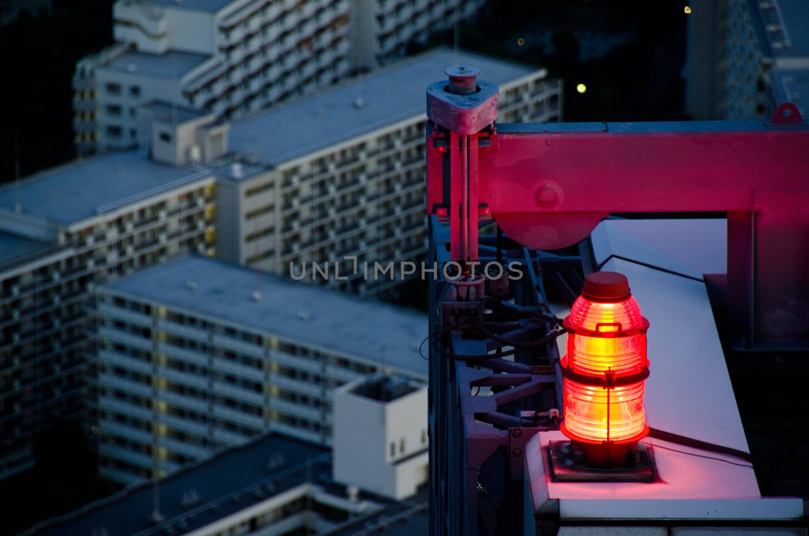 flashing red light for air traffic control at a skyscraper as seen from above