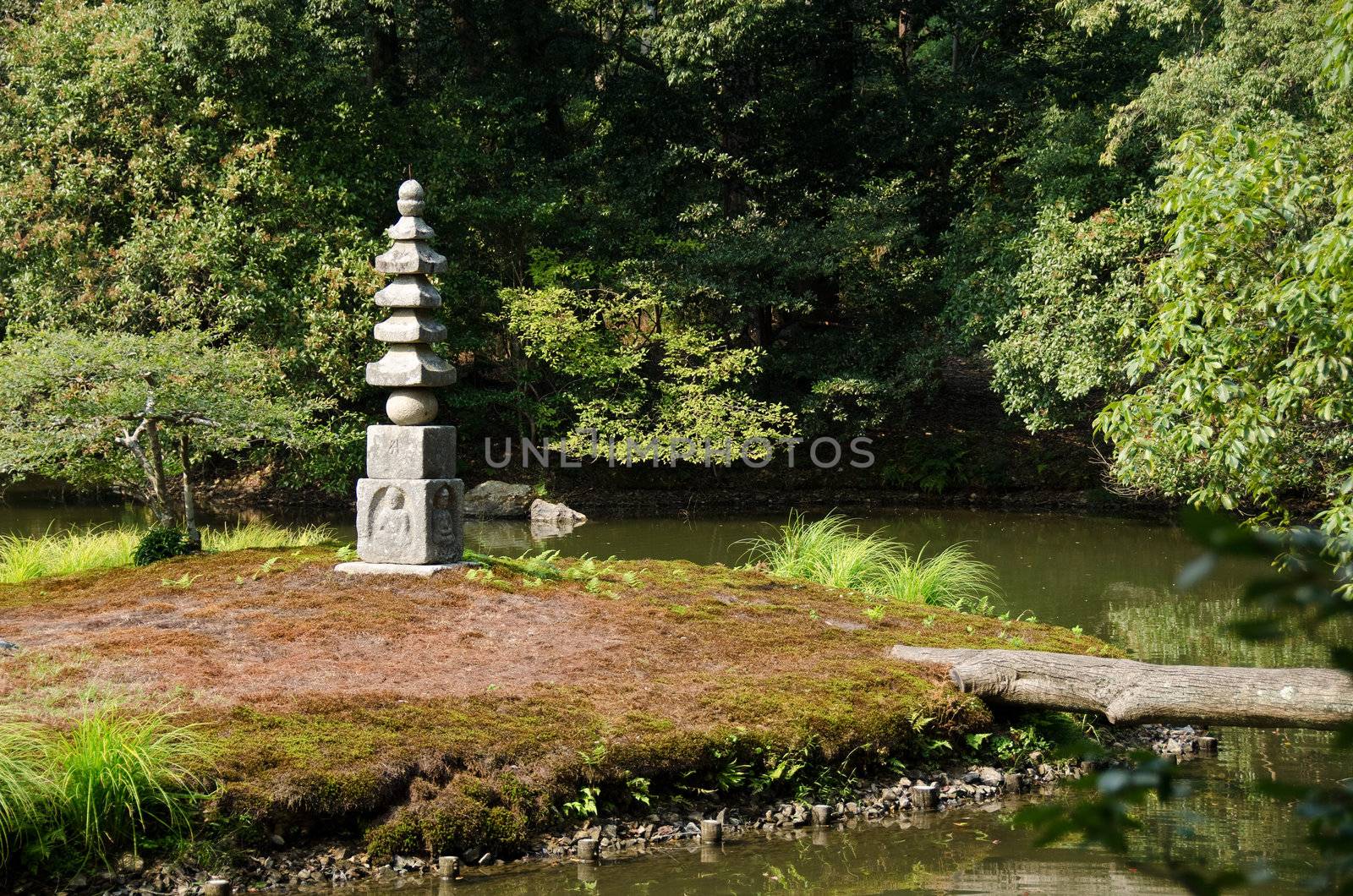 Japanese type of Buddhist pagoda on a island in the area of the Golden Temple in Kyoto, Japan