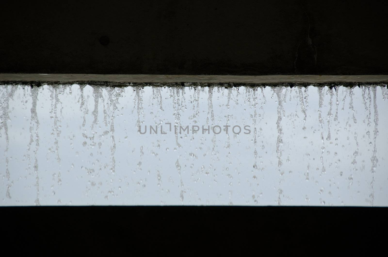 Curtain of water seen from inside a building