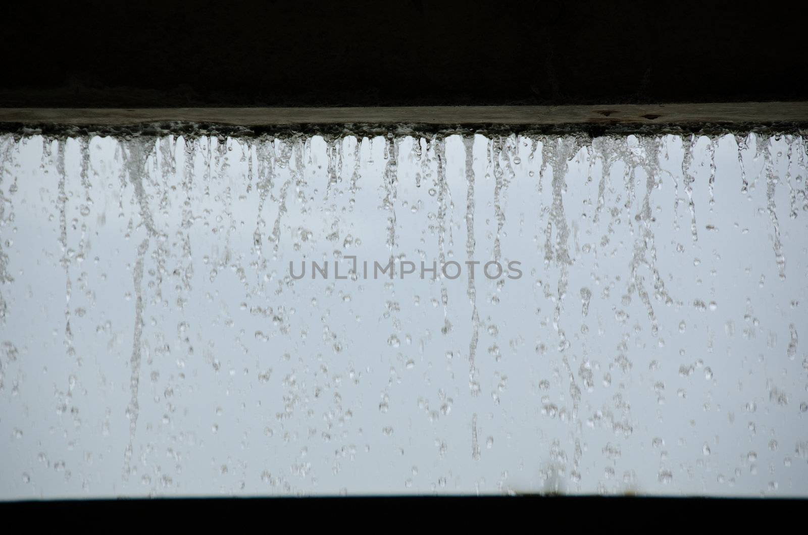 Curtain of water seen from inside a building