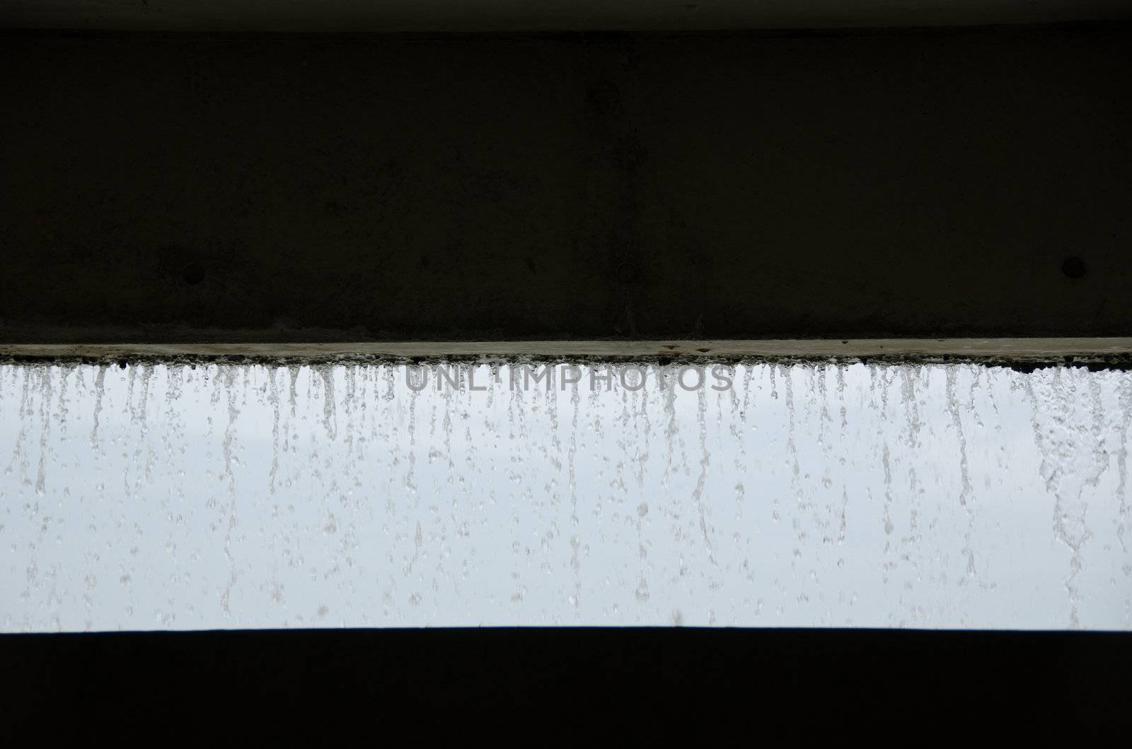 Curtain of water seen from inside a building