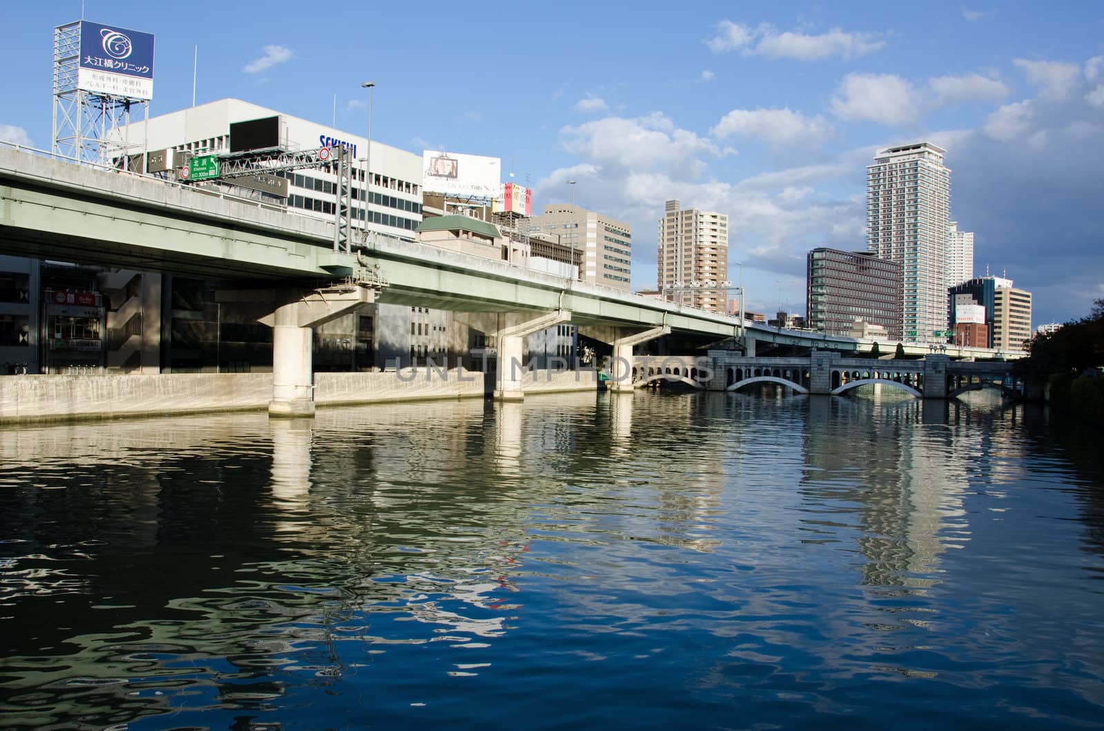 Water, Skyscrapers and highway in Osaka, Japan