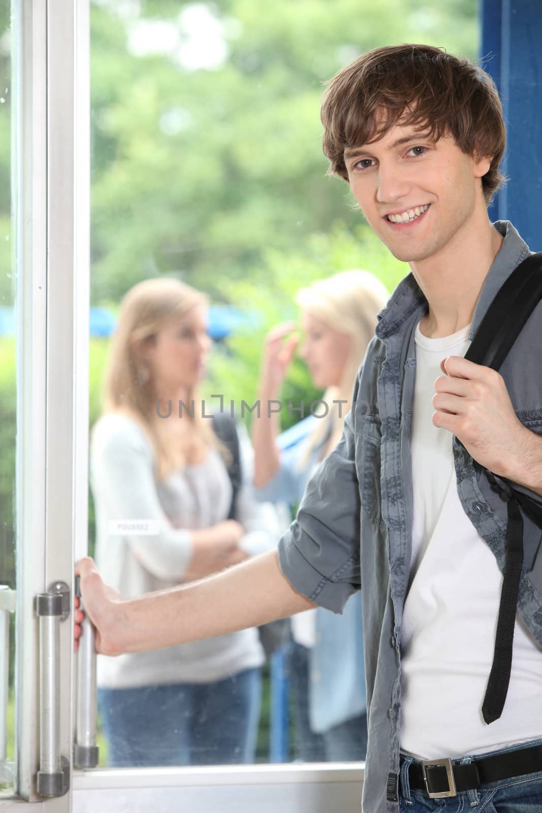Male student on campus by phovoir