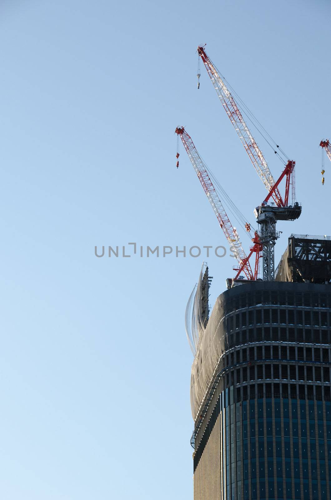 Crane on top of a skyscraper during construction