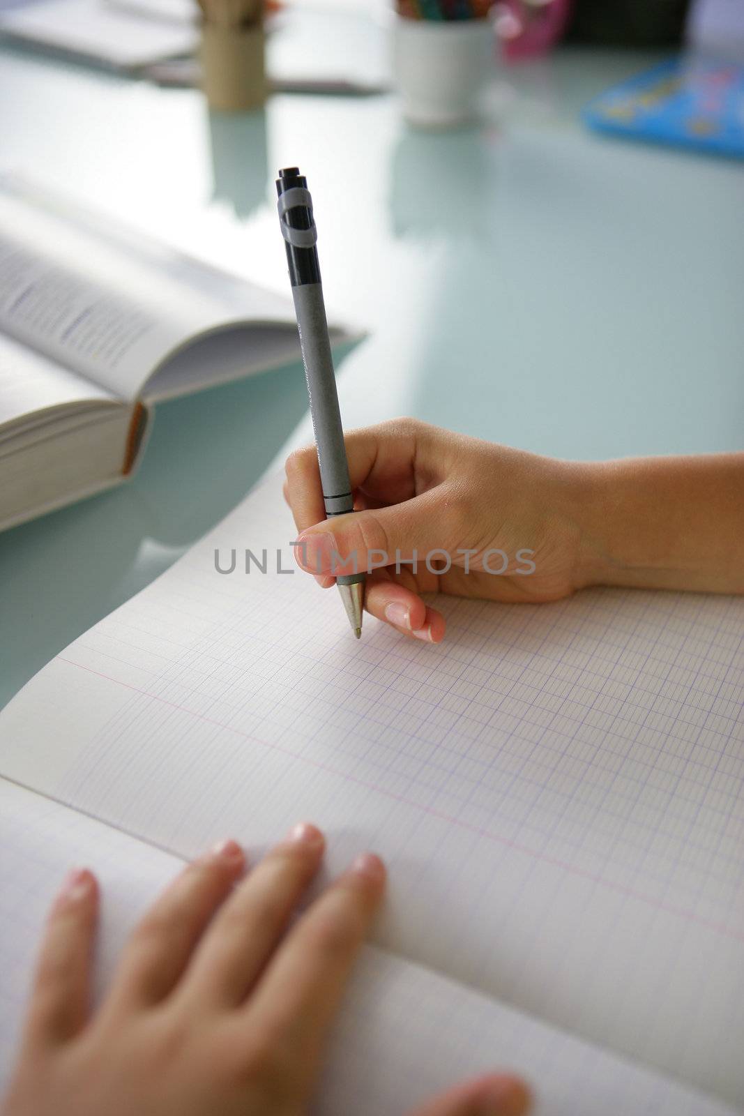 Woman studying hard for exams by phovoir