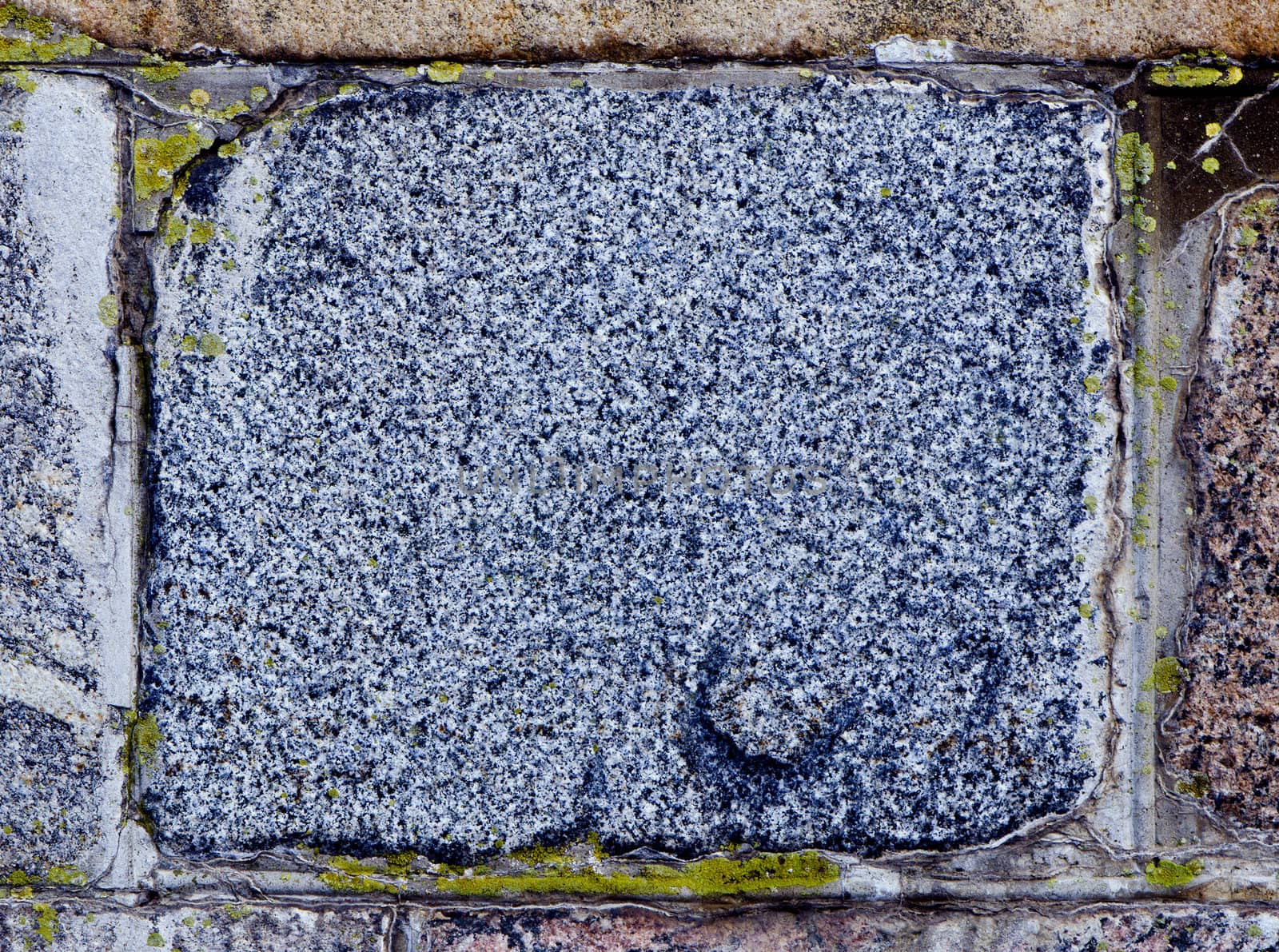 Ancient granite brick background closeup details.