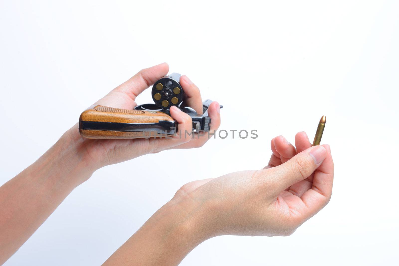 Woman's Hand With bullet 22  and revolver hand gun and Isolated On White Background